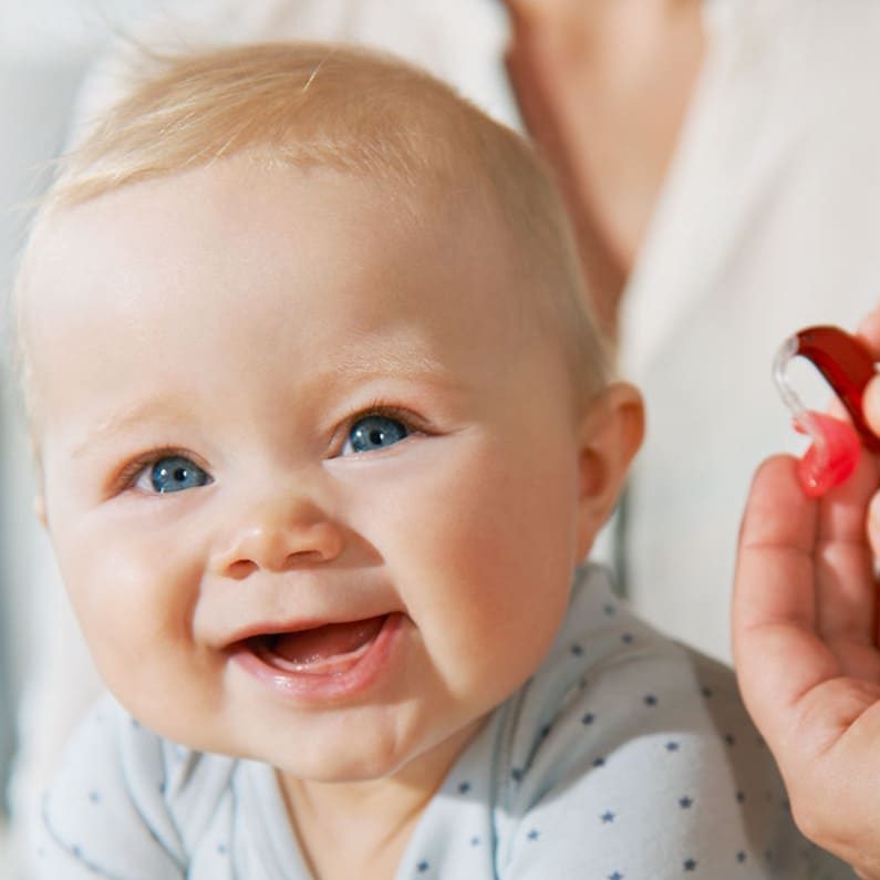 baby with hearing aid